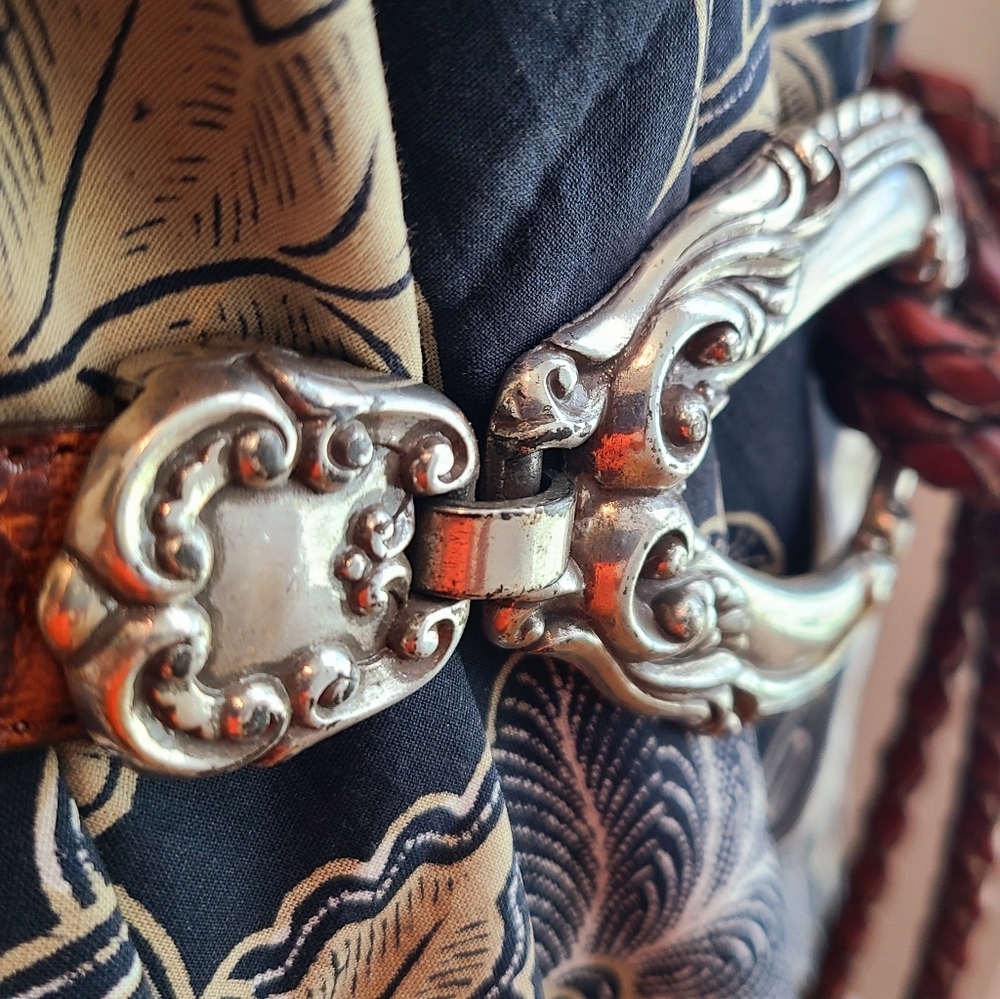 Leather belt with silver buckle.